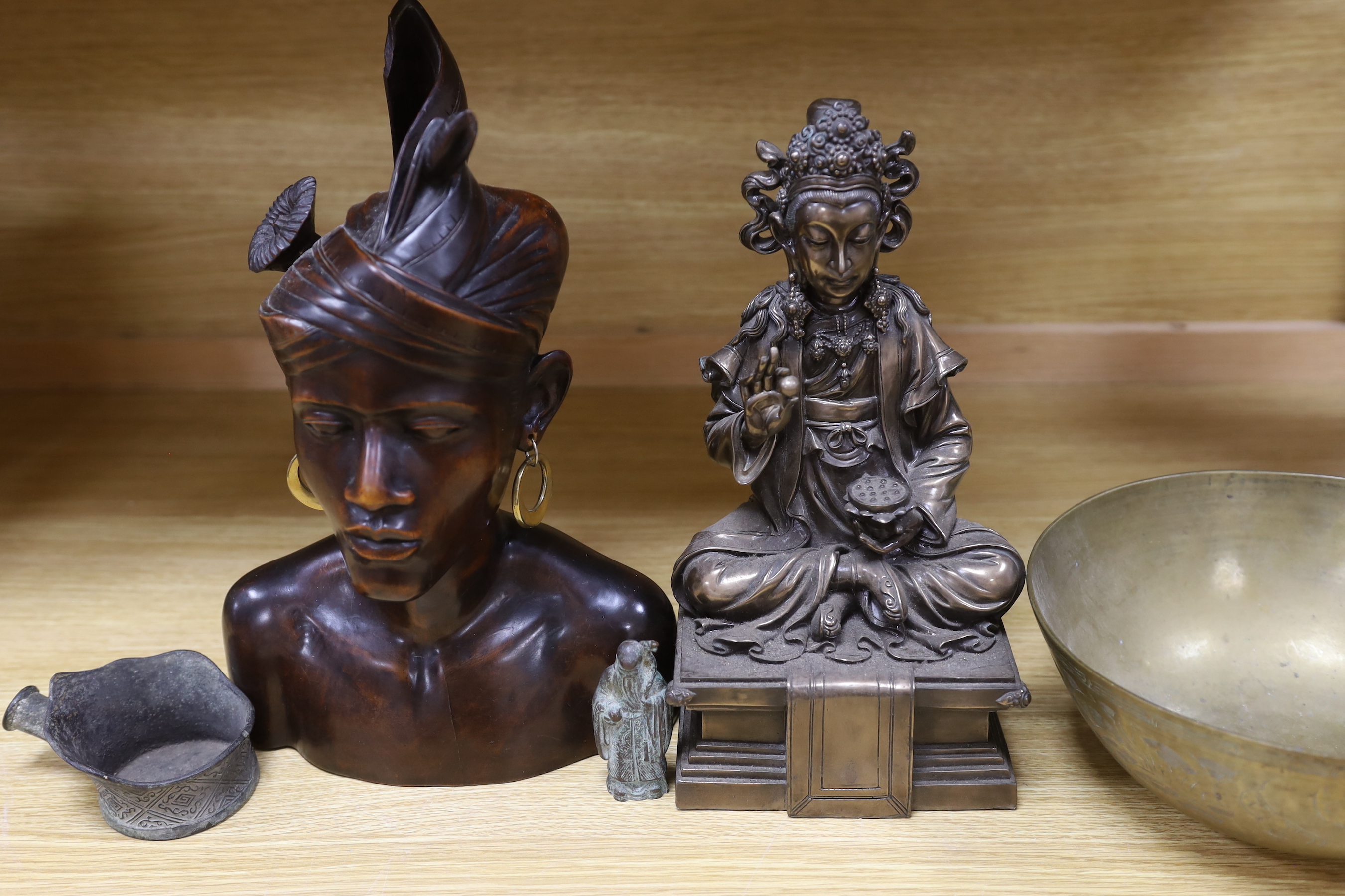 Two Chinese bronze figures, a similar bowl, an iron, and a Balinese wood bust etc, deity 32cm high